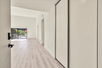 Located in the iconic Rose Garden community in central Palm