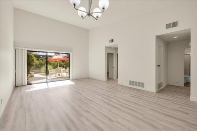 Located in the iconic Rose Garden community in central Palm