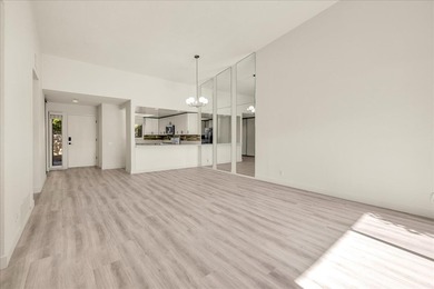 Located in the iconic Rose Garden community in central Palm