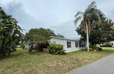 Located on a spacious corner lot in the sought-after gated