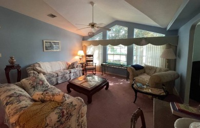 Located on a spacious corner lot in the sought-after gated