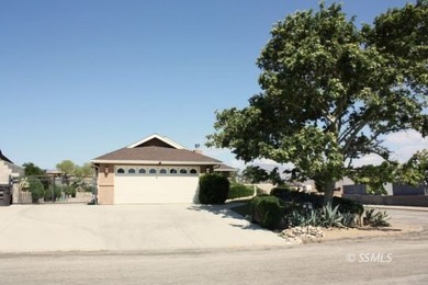 This immaculate home sits on a spacious corner lot, fully