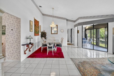 This two bedroom plus den, two full bath condo offers care-free