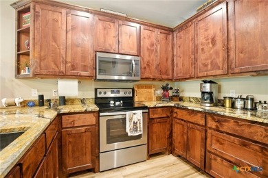 Guadalupe River?front living at its finest! Nestled in the gated