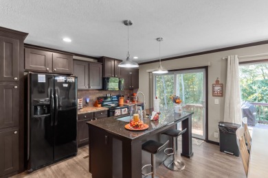 Escape to your own private retreat on over an acre of wooded