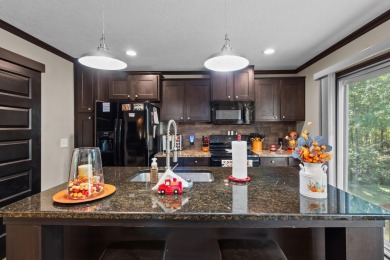 Escape to your own private retreat on over an acre of wooded