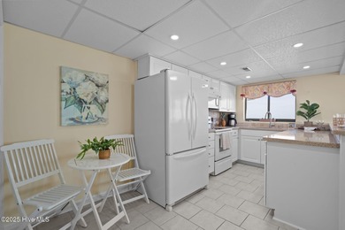 Welcome to Paradise! A fourth floor, fully furnished end unit