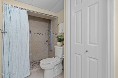 Welcome to Paradise! A fourth floor, fully furnished end unit