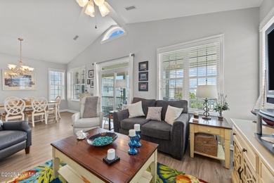 This meticulously maintained four-bedroom, three-bath waterfront