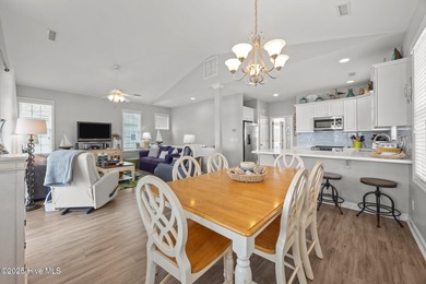 This meticulously maintained four-bedroom, three-bath waterfront