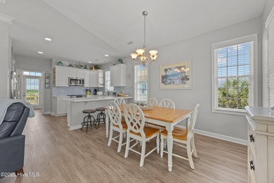 This meticulously maintained four-bedroom, three-bath waterfront