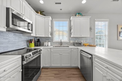 This meticulously maintained four-bedroom, three-bath waterfront