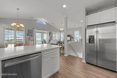 This meticulously maintained four-bedroom, three-bath waterfront