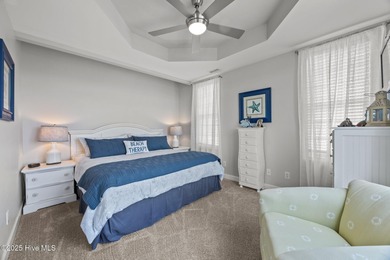 This meticulously maintained four-bedroom, three-bath waterfront