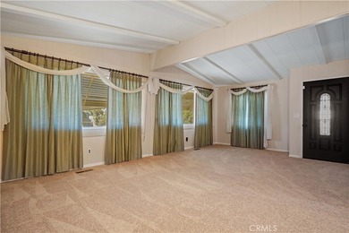 Spacious and inviting triple-wide home in a welcoming 55+