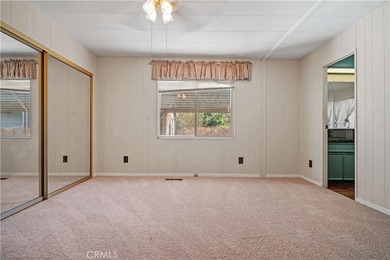 Spacious and inviting triple-wide home in a welcoming 55+