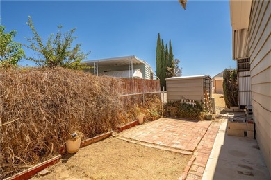 Spacious and inviting triple-wide home in a welcoming 55+