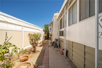 Spacious and inviting triple-wide home in a welcoming 55+