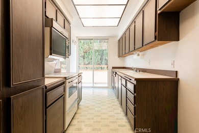 Attention investors and visionaries! This vacant condo needs