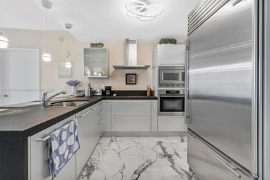 Live the oceanfront lifestyle in this beautifully renovated 1BR