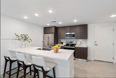 ELEGANT CONDO IN THE PRESTIGIOUS ENVY RESIDENCES. SPACIOUS OPEN