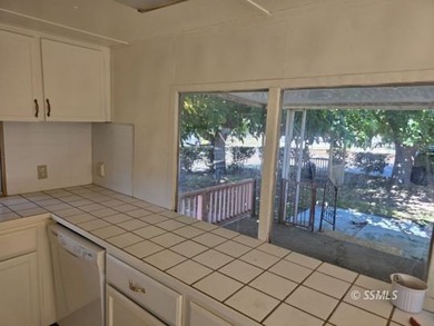 Situated on a nice corner lot, this older 2 bedroom, 1-1/2 bath