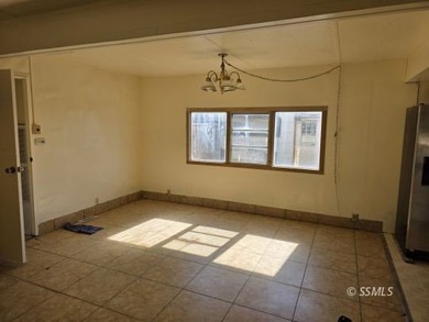 Situated on a nice corner lot, this older 2 bedroom, 1-1/2 bath