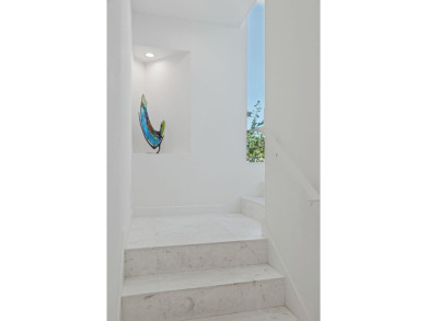 An architectural masterpiece, this Frank Lloyd Wright-inspired