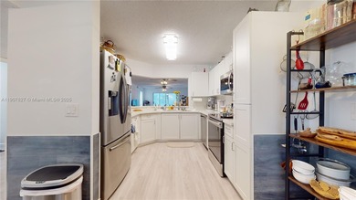 Immaculate 1st-floor unit in HOPA verified 55+ community. This