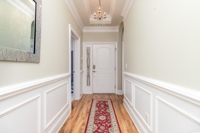 Welcome to this stunning 4-bedroom, 3-bathroom end unit condo