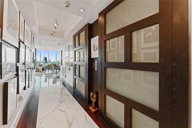 This trophy Penthouse comes with a 55' boat slip! Amazing