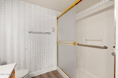 This delightful ground-floor condo offers convenience and