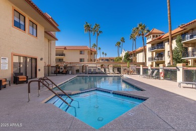 This delightful ground-floor condo offers convenience and