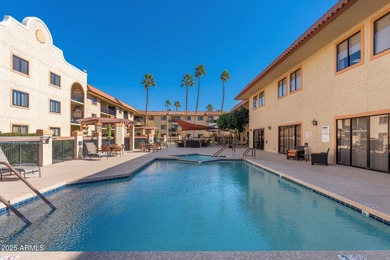 This delightful ground-floor condo offers convenience and