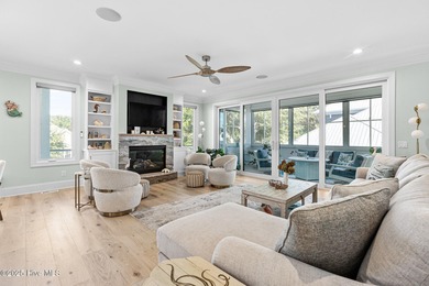 This gorgeous home in Kure Beach Village has 5 bedrooms, 5 1/2