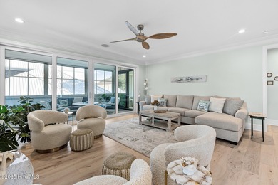 This gorgeous home in Kure Beach Village has 5 bedrooms, 5 1/2