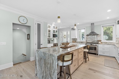 This gorgeous home in Kure Beach Village has 5 bedrooms, 5 1/2