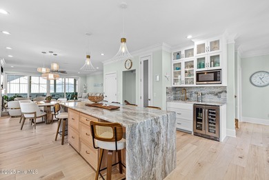 This gorgeous home in Kure Beach Village has 5 bedrooms, 5 1/2