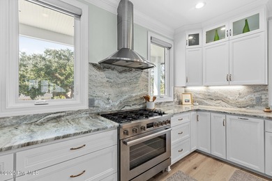 This gorgeous home in Kure Beach Village has 5 bedrooms, 5 1/2