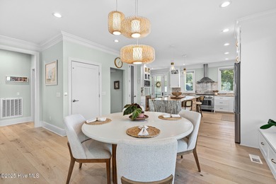 This gorgeous home in Kure Beach Village has 5 bedrooms, 5 1/2