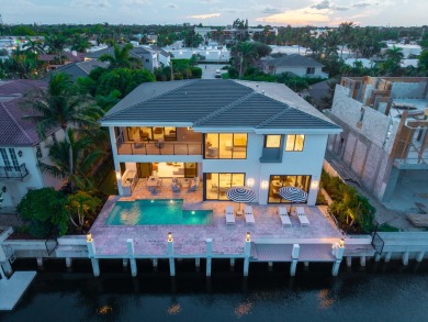 This extraordinary two-story waterfront estate is purpose-built