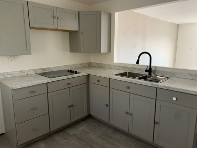 PRICE IMPROVED! Fantastic opportunity! TOP Floor 1/1.5 condo