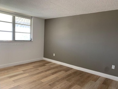 PRICE IMPROVED! Fantastic opportunity! TOP Floor 1/1.5 condo