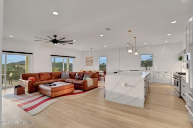 Modern coastal luxury abounds in this 3-story turnkey furnished