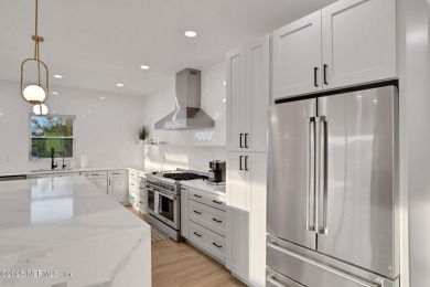 Modern coastal luxury abounds in this 3-story turnkey furnished