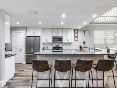 High and Dry! Elevated townhome, no living space on ground level