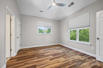 Enjoy low-maintenance lakeside living in this beautifully