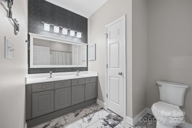 Enjoy low-maintenance lakeside living in this beautifully