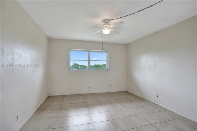 Move-in ready 1/1 top-floor unit with tile floors throughout
