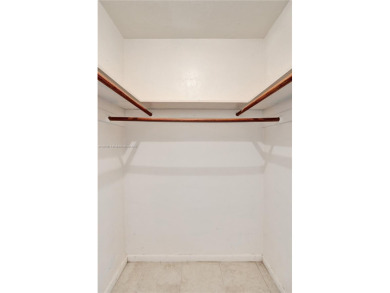 Move-in ready 1/1 top-floor unit with tile floors throughout